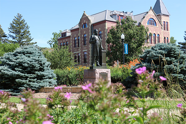 Statue of General Beadle with Beadle Hall in the background.
